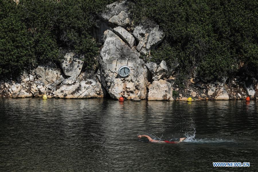 Greece's Vouliagmeni Lake attracts visitors