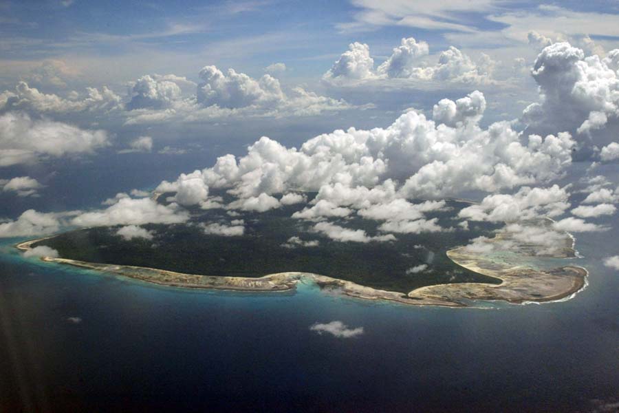 In this Nov. 14, 2005 file photo, clouds hang over the North Sentinel Island, in India's southeastern Andaman and Nicobar Islands. An American is believed to have been killed by an isolated Indian island tribe known to fire at outsiders with bows and arrows, Indian police said Wednesday, Nov. 21, 2018. Police officer Vijay Singh said seven fishermen have been arrested for facilitating the American's visit to North Sentinel Island, where the killing apparently occurred. Visits to the island are heavily restricted by the government. [File photo: AP]