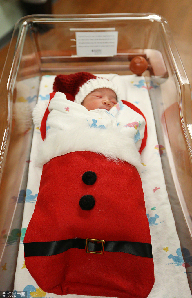 Newborn babies wear Christmas stockings in Missouri