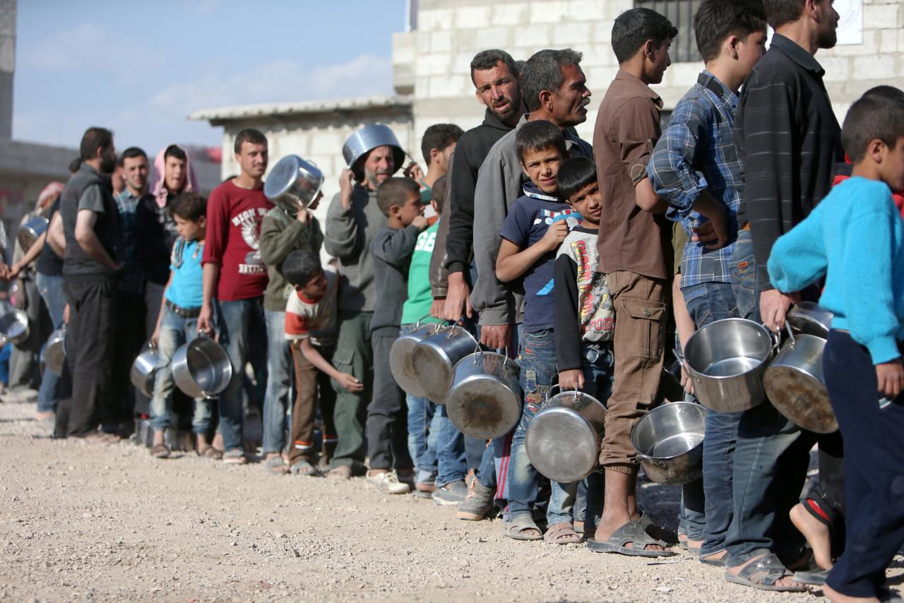 Image result for syrian queue for food reuters