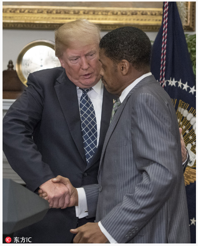 Trump delivers pull-and-jerk handshake to MLK's nephew 