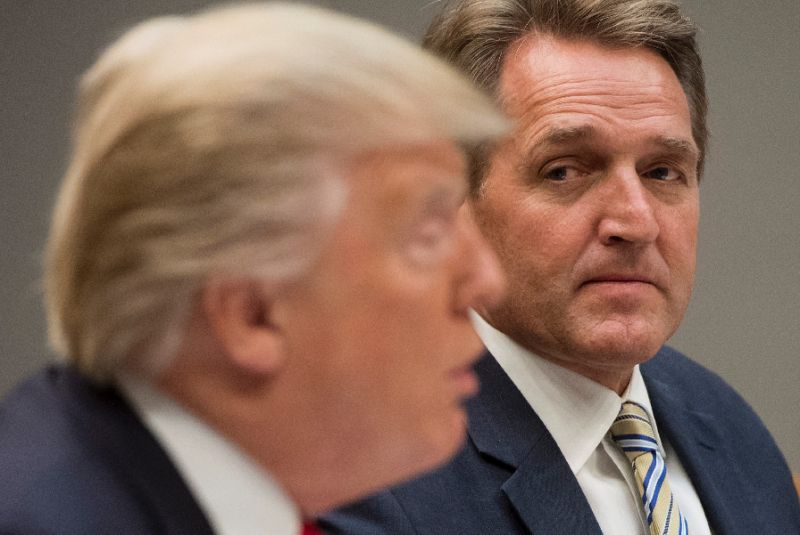 Senator Jeff Flake, pictured with Donald Trump in this December 5, 2017 photo, has been critical of both the president and his Republican party