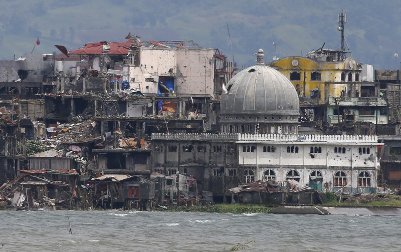 A few militants fight on in Philippine city ripped to shreds