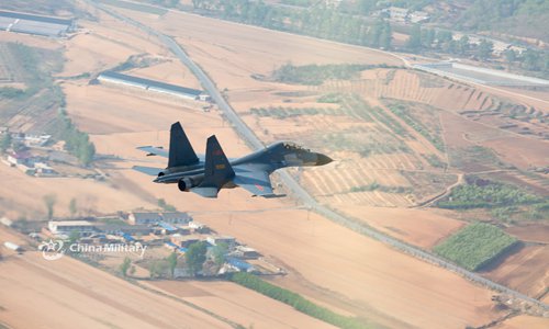 J-11B fighter jets fly through valley