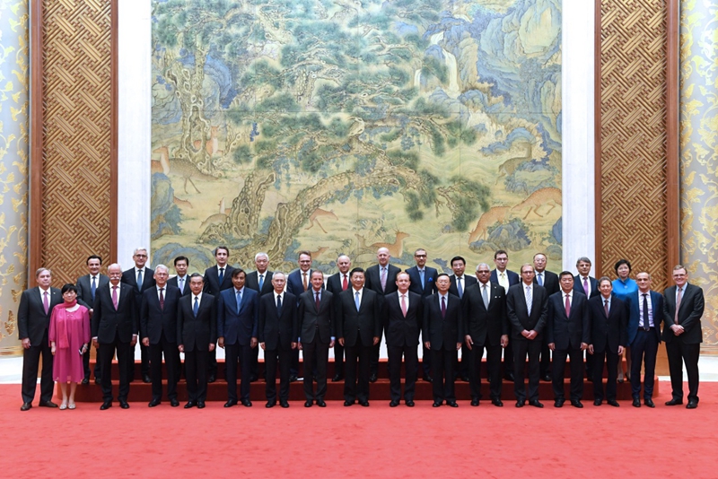 Chinese President Xi Jinping meets with executives of some famous multinational enterprises, who are in Beijing to attend a special session of round-table summit of Global CEO Council, on Thursday, June 21, 2018. [Photo: Xinhua]