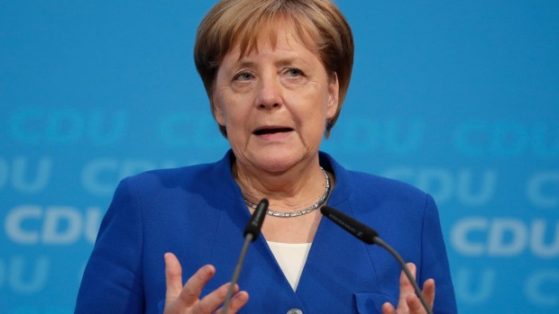 Merkel dodges political bullet with controversial migrant deal