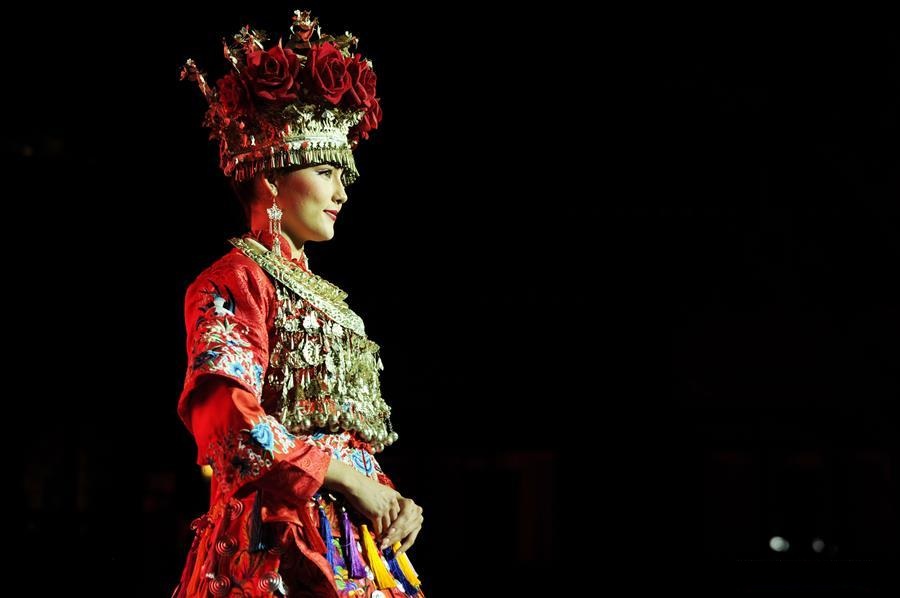 Models present traditional costumes of Miao ethnic group in China's Guizhou